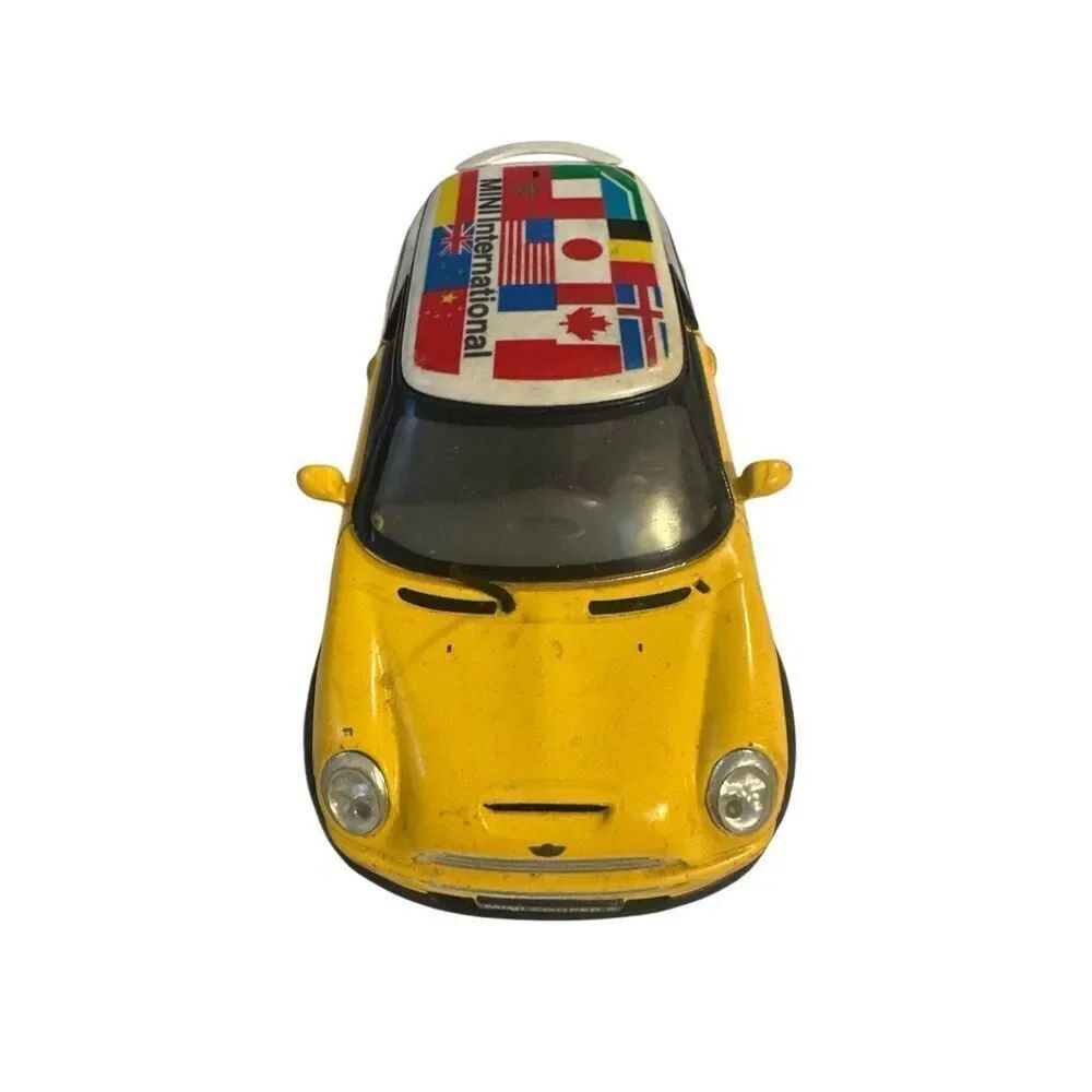 Yellow Toy Car with International Flags